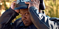 Man putting on motorcycle helmet